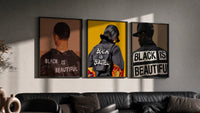 Black Is Beautiful Set of 3 in black frames on a grey wall above a leather sofa
