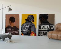 Black Is Beautiful Set of 3 displayed beside a brown leather sofa