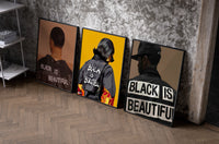 Black Is Beautiful Set of 3 as black-framed prints leaning against a raw-plaster wall
