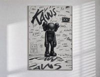 Head-bowed KAWS Companion poster in a slim frame on a bright wall with soft window light