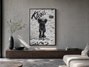 KAWS Companion figure standing poster framed above a wood console in a concrete-wall living room