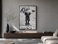 Head-bowed KAWS Companion poster framed above a wood console in a concrete-wall living room