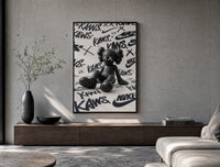 Black KAWS Companion figure sitting poster framed above a wood console in a concrete-wall living room