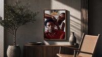 Black Man Having His Hair Braided poster framed above a fluted sideboard beside a potted tree
