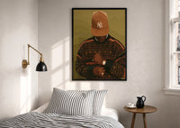 Black Man in Brown Baseball Cap print in a black frame above a bed with striped linens, a brass wall lamp and a sunlit window