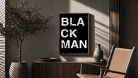 Black Man Lettering poster framed above a fluted sideboard beside a potted tree
