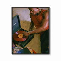 Framed Black Man Playing a Vinyl Record print shown as a bold statement piece on a clean gallery wall