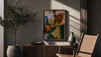 Black Man Playing a Vinyl Record poster framed above a fluted sideboard beside a potted tree