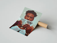 Gently curled Black Man Reading a Paperback print beside its protective shipping tube
