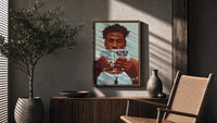 Black Man Reading a Paperback poster framed above a fluted sideboard beside a potted tree