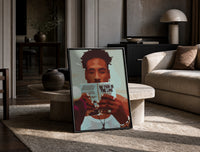 Black Man Reading a Paperback print on the floor, leaning against a travertine table