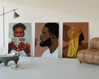 Black Man Reading and Grooming Set of 3 displayed beside a brown leather sofa