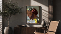 Black Man with Colorful Hair Clips poster framed above a fluted sideboard beside a potted tree