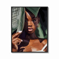 Framed Black Woman with Tropical Leaves print shown as a bold statement piece on a clean gallery wall