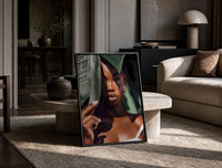 Black Woman with Tropical Leaves print on the floor, leaning against a travertine table