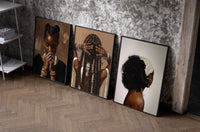 Black Woman Hairstyles Set of 3 as black-framed prints leaning against a raw-plaster wall
