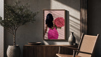 Black Woman Holding Pink Roses poster framed above a fluted sideboard beside a potted tree