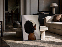 Black Woman with a Curly Puff print on the floor, leaning against a travertine table