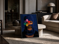 Blue Ski Mask with a Flower print on the floor, leaning against a travertine table