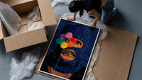 Blue Ski Mask with a Flower framed print being unpacked from protective bubble wrap and a box