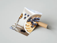 Gently curled Blueberry Banana Oatmeal Bowl print beside its protective shipping tube