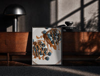 Blueberry Pancakes with Chocolate poster framed above a fluted sideboard beside a potted tree