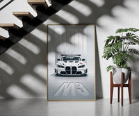 BMW M3 GT Race framed print on a staircase entryway wall beside a plant