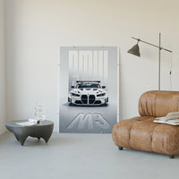 BMW M3 GT Race poster framed above a tan leather living-room couch