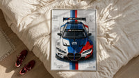 BMW M4 GT3 M Power framed print styled on a bed with sneakers alongside