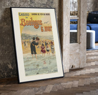 Woman and children wading at beach print in a black frame leaning beside a vintage door on parquet