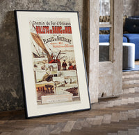 Breton fishing boat and coastal scenes print in a black frame leaning beside a vintage door on parquet