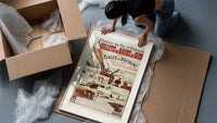 Breton fishing boat and coastal scenes framed print being unpacked from protective bubble wrap and a box