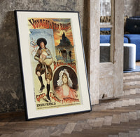 Breton bagpiper and young woman print in a black frame leaning beside a vintage door on parquet