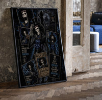 Skeleton musician in top hat print in a black frame leaning beside a vintage door on parquet