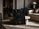 Skeleton musician in top hat print in a black frame leaning on a travertine table in a sunlit lounge