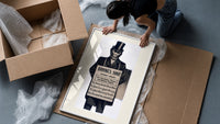Monkey in top hat and suit framed print being unpacked from protective bubble wrap and a box