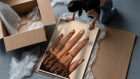 Brown Almond Nails framed print being unpacked from protective bubble wrap and a box