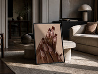 Brown French Tips print on the floor, leaning against a travertine table