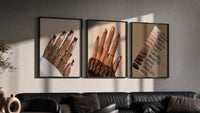 Brown Manicures and Swatches Set of 3 in black frames on a grey wall above a leather sofa