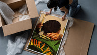 Brushing Waves in a Varsity Jacket framed print being unpacked from protective bubble wrap and a box