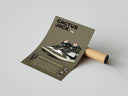 Cactus Jack Jordan 1 High OG olive mocha poster with editorial text displayed as rolled print