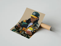Gently curled Camo Jacket and Takeaway Drink print beside its protective shipping tube