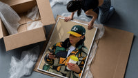 Camo Jacket and Takeaway Drink framed print being unpacked from protective bubble wrap and a box