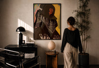 Cap and Paisley Bandana print in a black frame on a sunlit plaster wall, a woman looking on beside a mushroom lamp