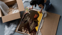 Cap and Paisley Bandana framed print being unpacked from protective bubble wrap and a box