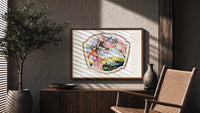 Elegant woman under blossoming tree print in a wood frame above a fluted sideboard beside an olive tree