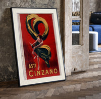 Woman dancing with champagne bottle print in a black frame leaning beside a vintage door on parquet