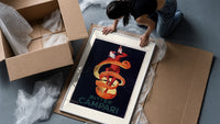 Clown wrapped in orange peel framed print being unpacked from protective bubble wrap and a box