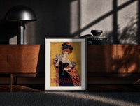 Black-framed Elegant woman in evening gown print on a moody console with designer coffee-table books