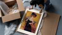 Elegant woman in evening gown framed print being unpacked from protective bubble wrap and a box